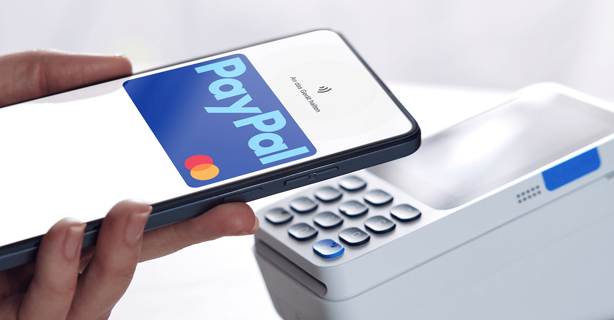 Person taps a PayPal card on a card reader to make a contactless payment over NFC/QR.