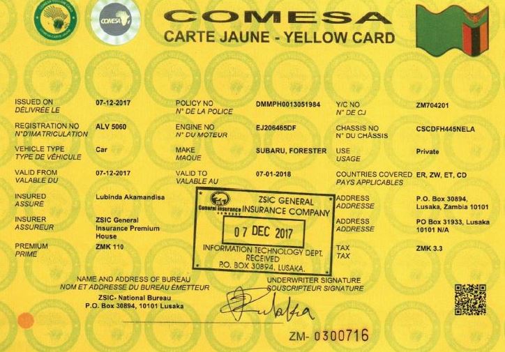 comesa-insurance-yellow-card - Rent A Driver Uganda Front of a yellow vehicle insurance card (Comesa Yellow Card) with multiple seals, logos, and alphanumeric codes, including a stamped date '07 DEC 2017' and 'ZSIC General Insurance Company'.